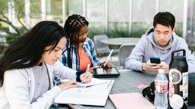 Students studying at a table